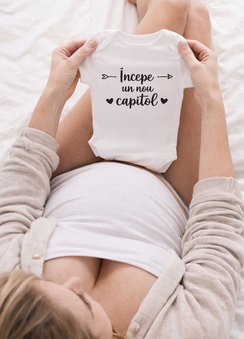 Body bebeluș anunț sarcină „Începe un nou capitol”