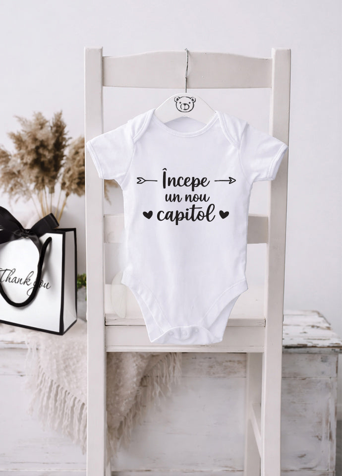 Body bebeluș anunț sarcină „Începe un nou capitol”